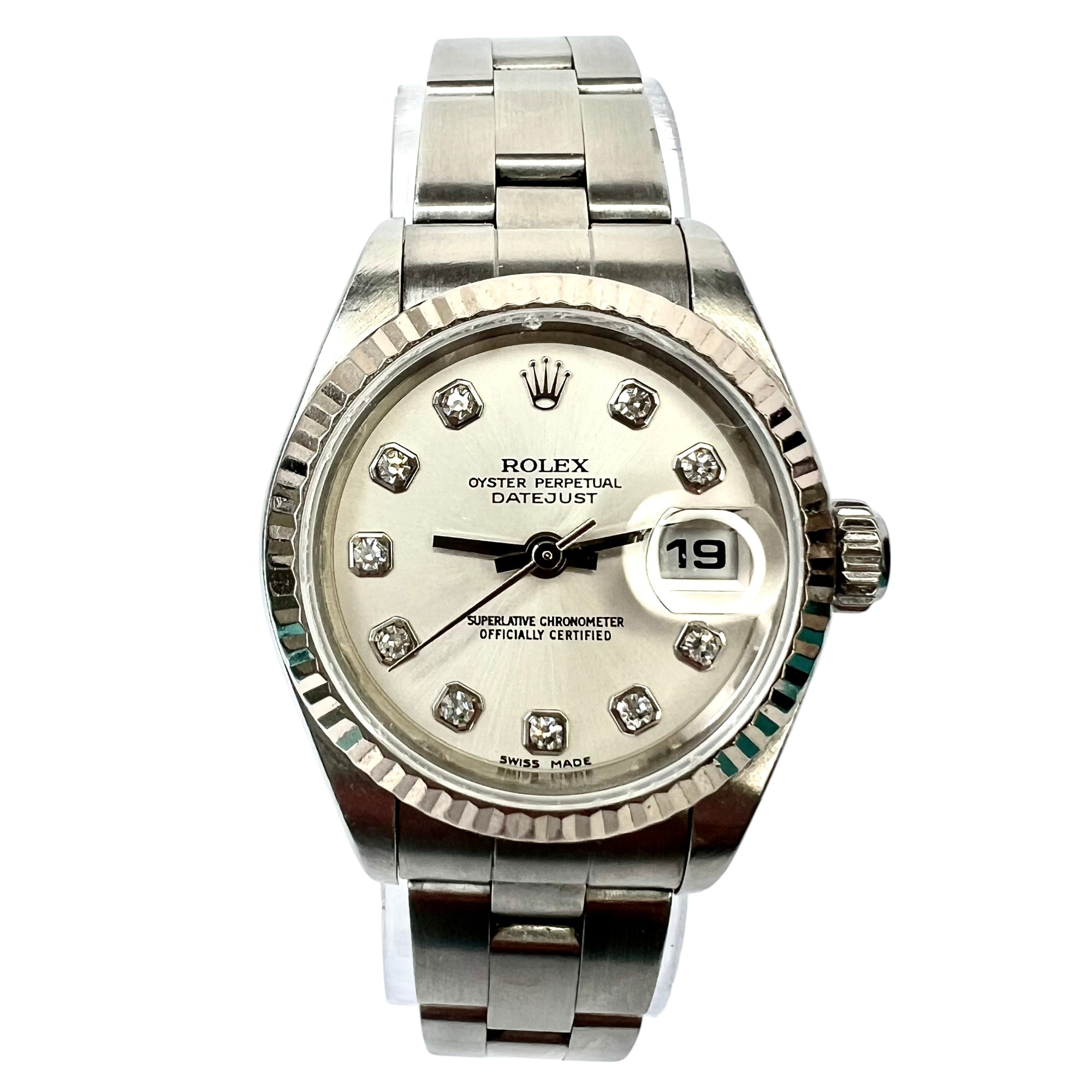 Model/Collection Name: Oyster Perpetual Datejust, Movement: Automatic, Functions: Date Indicator, Case Diameter/Width: 26 mm, Dial: Silver, Crystal: Scratch Resistant Sapphire Crystal.